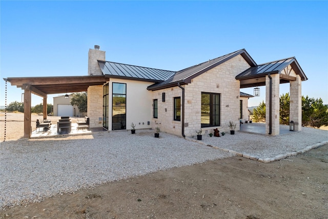 back of house with a garage