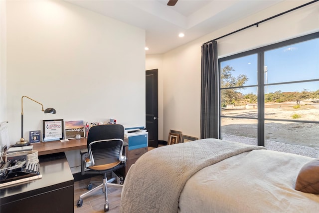 bedroom with ceiling fan and wood-type flooring