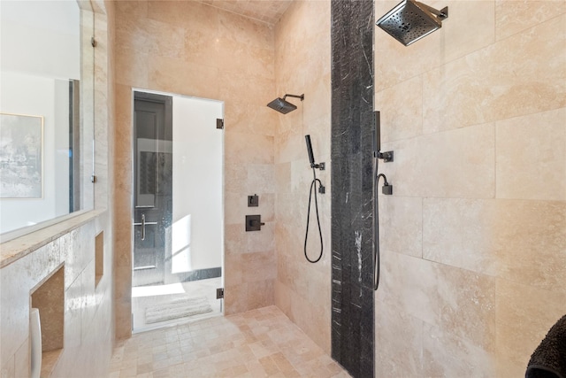 bathroom with tiled shower