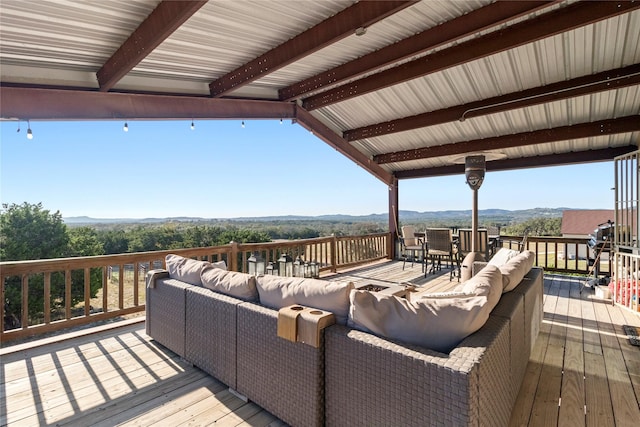 wooden deck featuring an outdoor hangout area