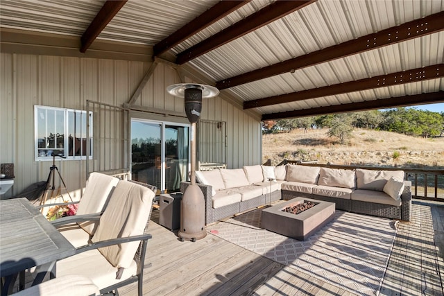 wooden deck with an outdoor living space with a fire pit