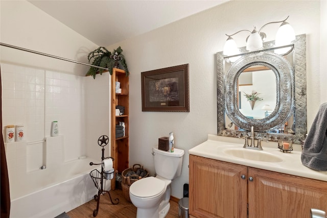 full bathroom with vanity, lofted ceiling, hardwood / wood-style flooring, toilet, and shower / bathtub combination