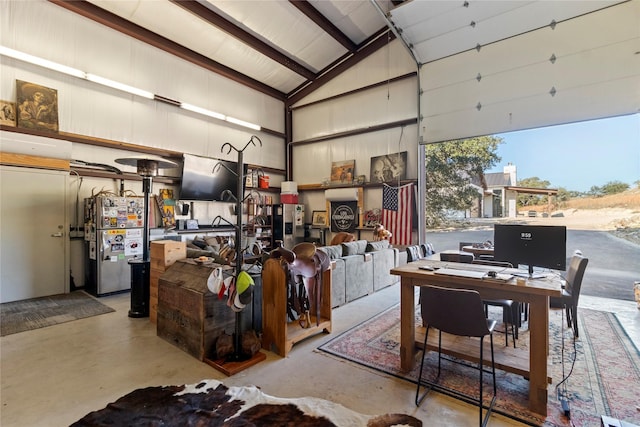 garage with stainless steel refrigerator