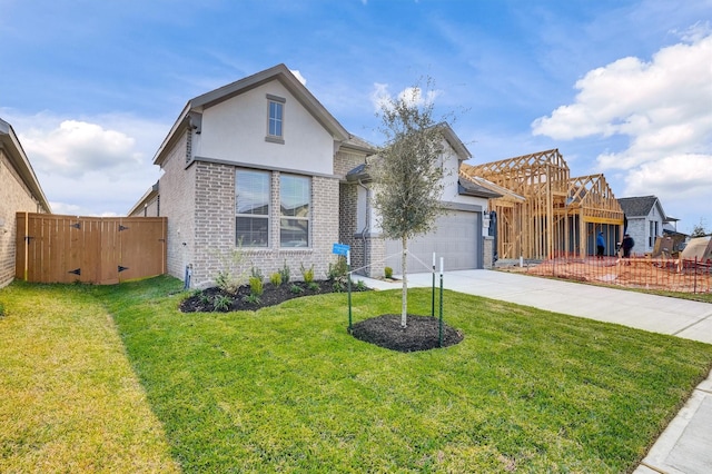 view of front facade with a garage and a front lawn