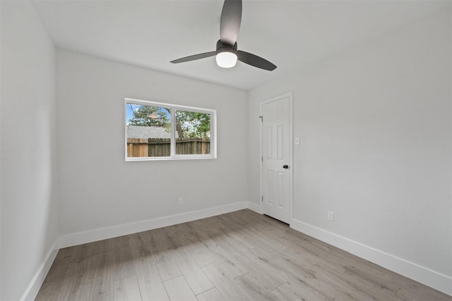 unfurnished room featuring ceiling fan and light wood-type flooring