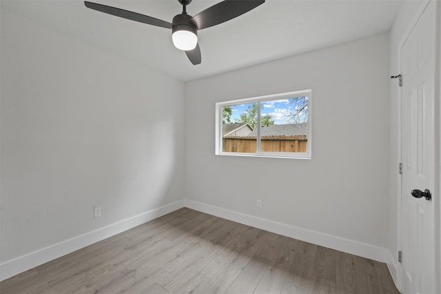 empty room featuring ceiling fan and light wood-type flooring