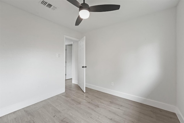 empty room with ceiling fan and light wood-type flooring