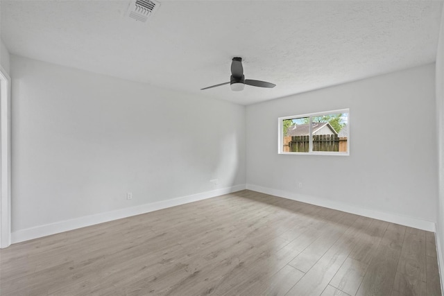 spare room with ceiling fan and light hardwood / wood-style flooring