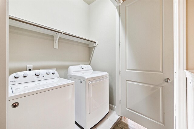 laundry area with independent washer and dryer