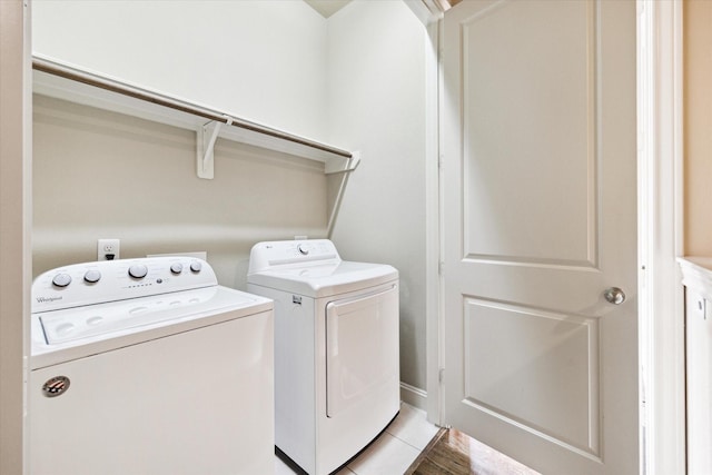 laundry room with laundry area and washing machine and clothes dryer