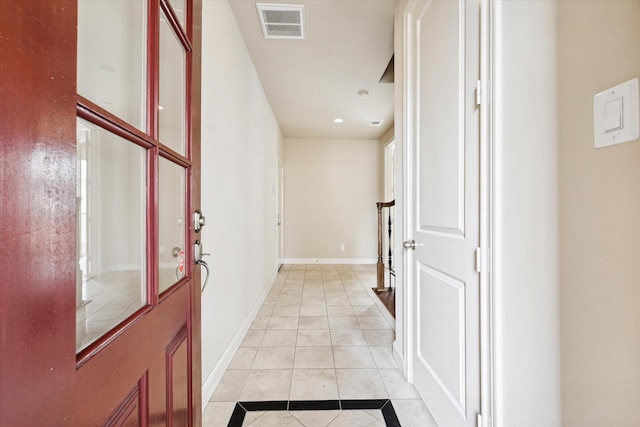 entryway with light tile patterned floors