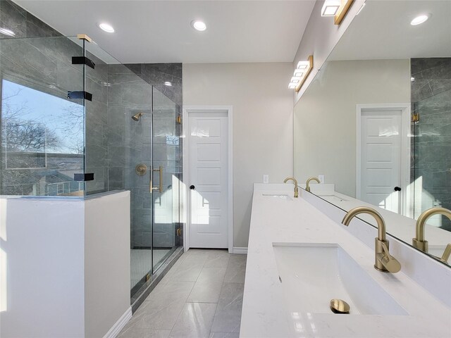 bathroom with a wealth of natural light, vanity, tile patterned floors, and a shower with door