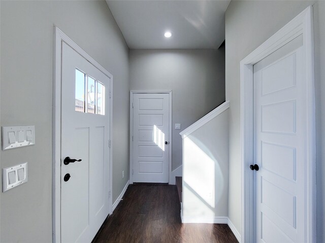 entryway with dark wood-type flooring