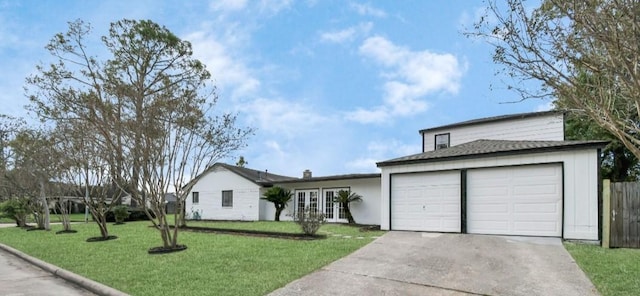 ranch-style home with a garage and a front yard