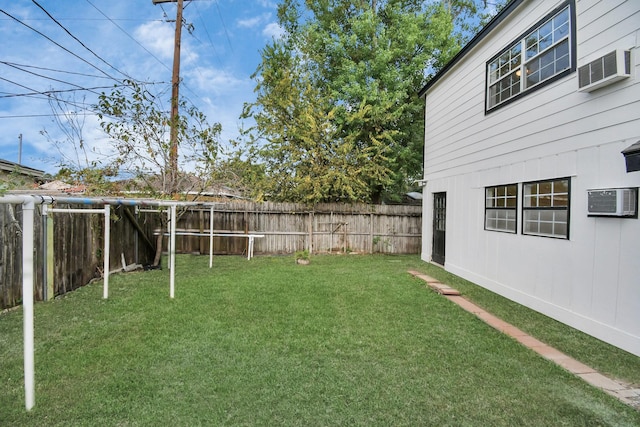 view of yard with a wall mounted air conditioner