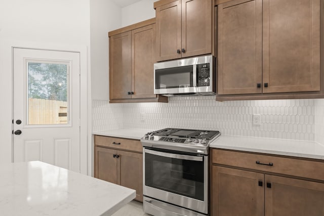 kitchen featuring decorative backsplash and stainless steel appliances