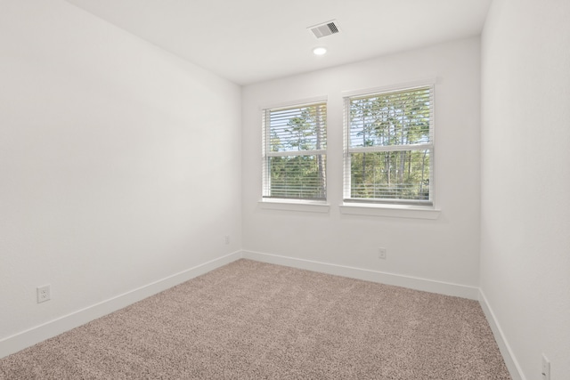 unfurnished room featuring carpet floors