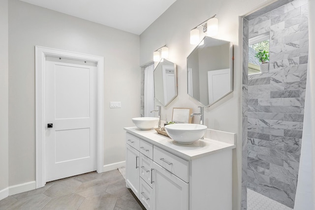 bathroom featuring vanity and a tile shower