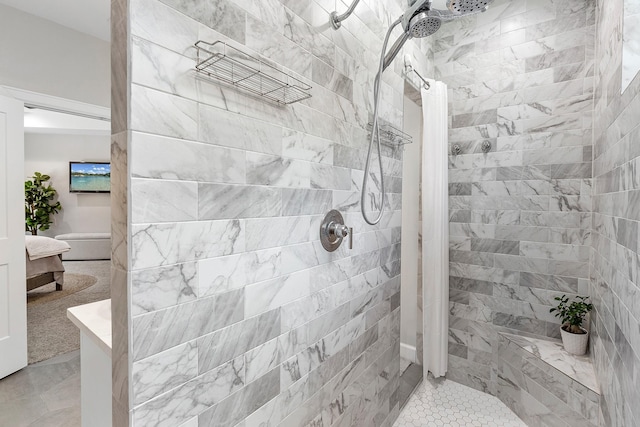 bathroom with a tile shower