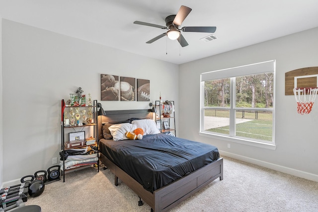 bedroom featuring light carpet and ceiling fan