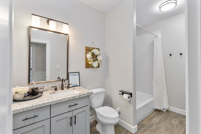 full bathroom with vanity, wood-type flooring, toilet, and shower / bathtub combination with curtain