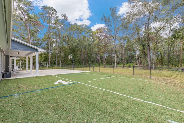 view of yard with ceiling fan and a patio