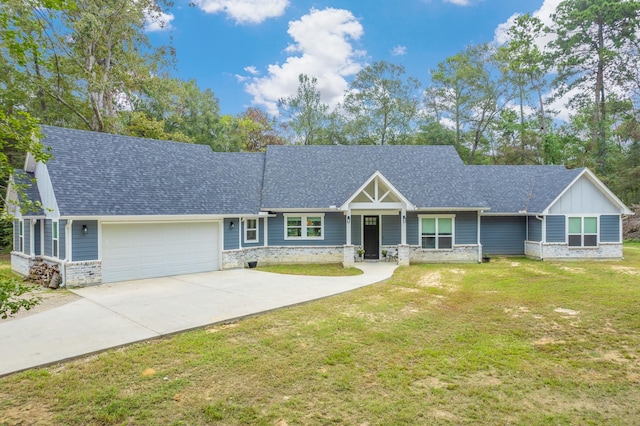 view of front of house featuring a front yard and a garage