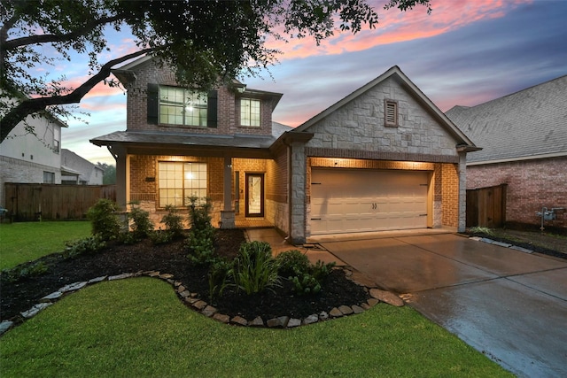 craftsman-style house with a yard and a garage