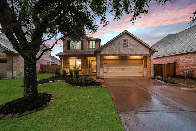 view of front facade with a lawn and a garage