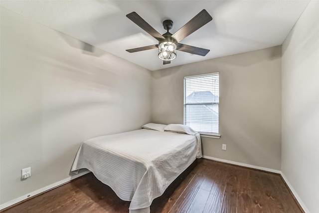 bedroom featuring ceiling fan and dark wood-type flooring