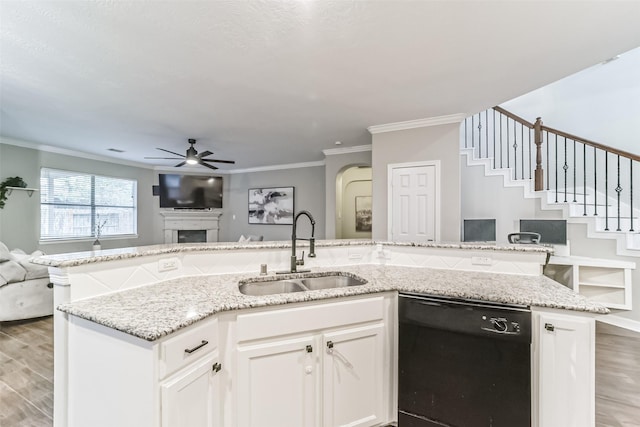 kitchen with ceiling fan, crown molding, sink, white cabinets, and black dishwasher