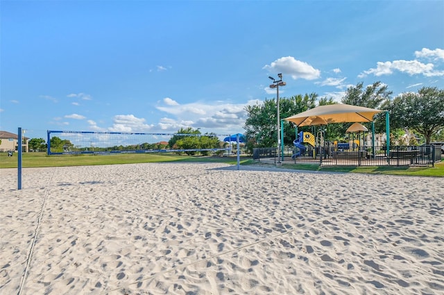 view of home's community featuring volleyball court and a playground