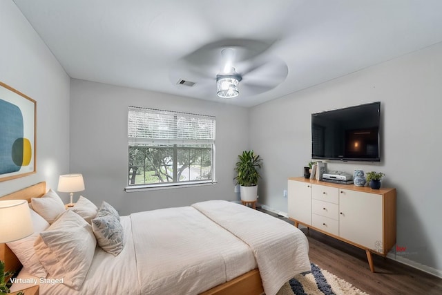 bedroom featuring ceiling fan and dark hardwood / wood-style floors