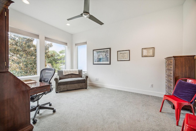 office with light carpet and ceiling fan