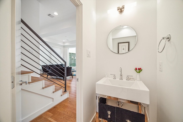 bathroom featuring wood-type flooring