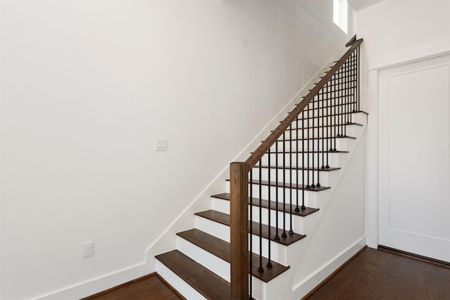 stairs with wood-type flooring