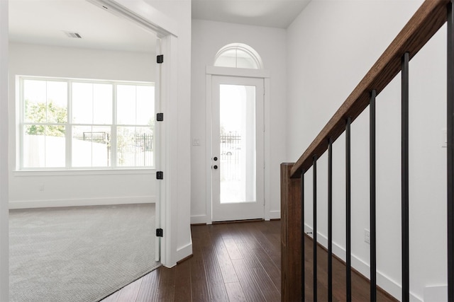 entryway with dark wood-type flooring