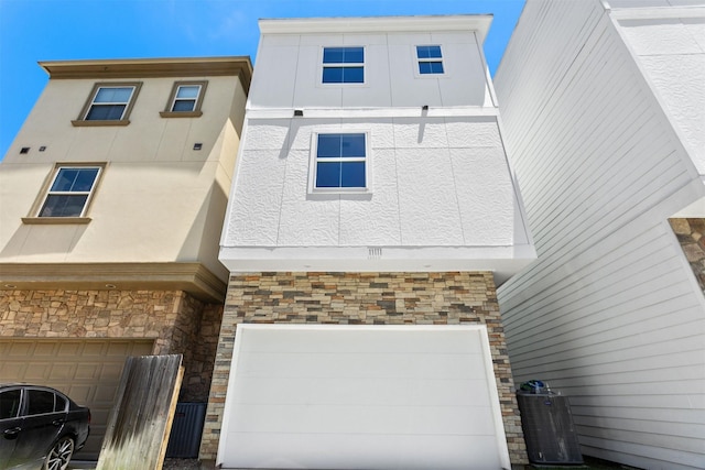 townhome / multi-family property featuring a garage