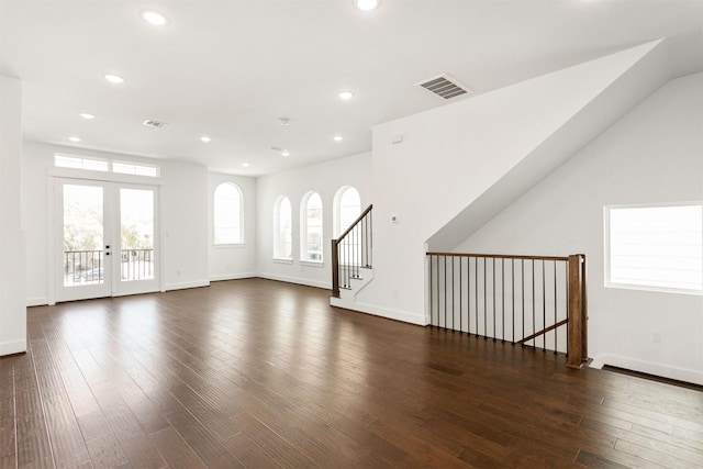 unfurnished living room with french doors and dark hardwood / wood-style floors