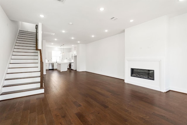 unfurnished living room featuring dark hardwood / wood-style flooring