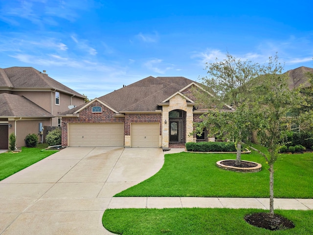 view of front of house with a garage and a front lawn