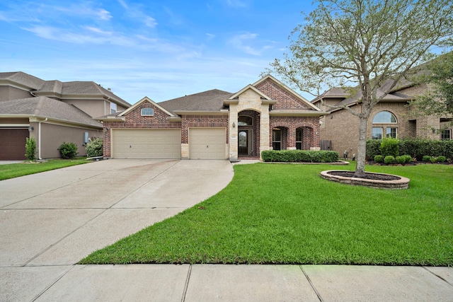 view of front of property featuring a garage and a front yard