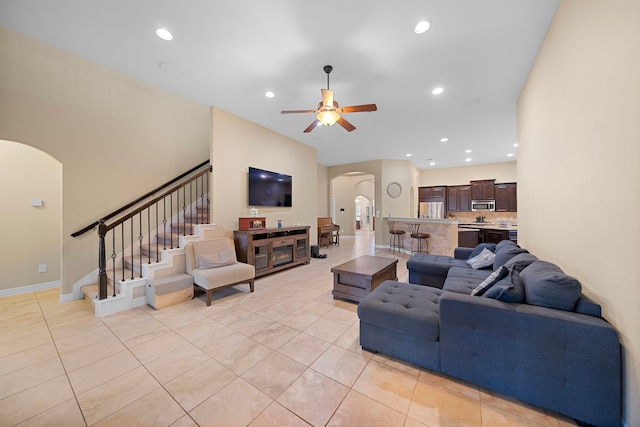 tiled living room with ceiling fan