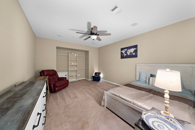 bedroom featuring light colored carpet and ceiling fan