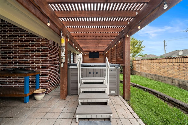 view of patio / terrace with a pergola and a hot tub