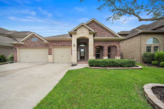 view of front facade with a front yard and a garage