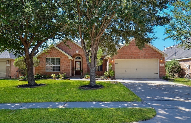 view of front of house with a front lawn and a garage