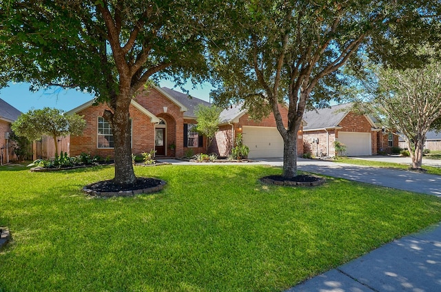 single story home featuring a garage and a front lawn