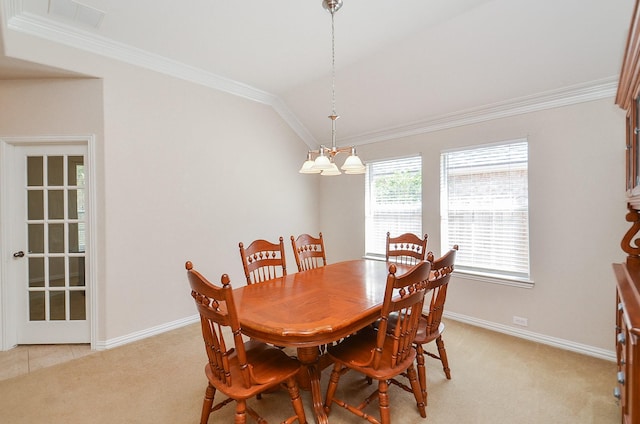 dining room with light carpet, an inviting chandelier, and ornamental molding