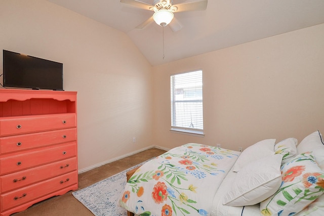 carpeted bedroom with ceiling fan and vaulted ceiling